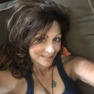 A smiling woman, partner portrait